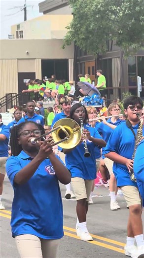 Royal High School Marching Band plays during Battle of Flowers Parade