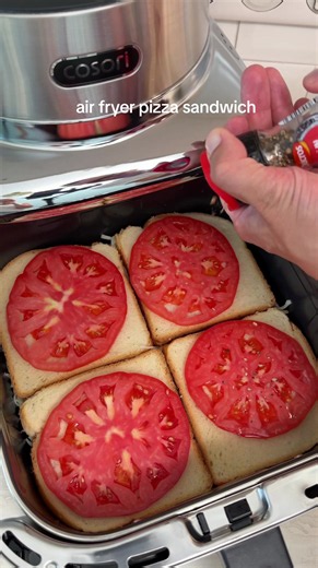 air fryer pizza sandwich turn simple sandwich bread into cheese pizza, spread with pizza sauce add ham and mozzarella, top with another slice of bread, then add fresh tomato slices and more mozzarella air fry at 190C/374F for 10 min until golden and melted #airfryerrecipes #panpizza #pizzasandwich #airfryerpizza #foodtok