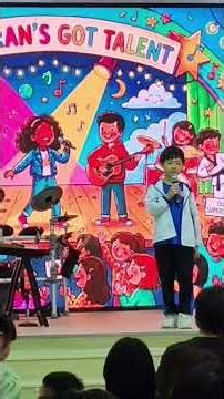 Maximus, at just 6 years old, takes the stage for school singing performance, beautiful song 7 Years