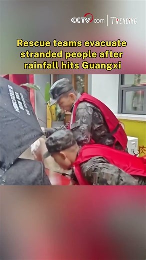 Rescue teams evacuate stranded people after rainfall hits Guangxi