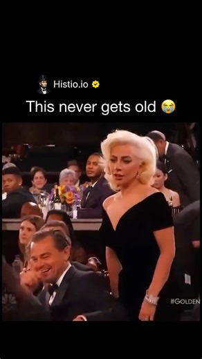 HISTIO on Instagram: "At the 2016 Golden Globes, Lady Gaga won Best Actress for *American Horror Story: Hotel* and made her way to the stage—gown flowing, focused on her moment. As she squeezed past the tables, she accidentally brushed against Leonardo DiCaprio’s chair. Leo flinched, widened his eyes, and let out an unmistakable “what just happened?” smirk-laugh that the cameras caught perfectly. The internet exploded: memes, GIFs, slow-motion replays—Leo’s priceless reaction became one of the n