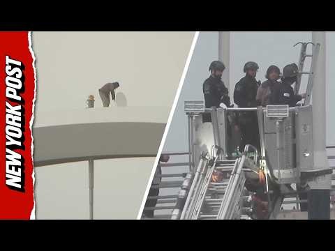 Protester Climbs Down DC Bridge After Five Days