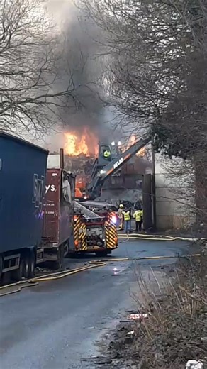 Machines in operation can be seen as firefighters battle a blaze at a scrapyard in Kingswinford: | Express & Star