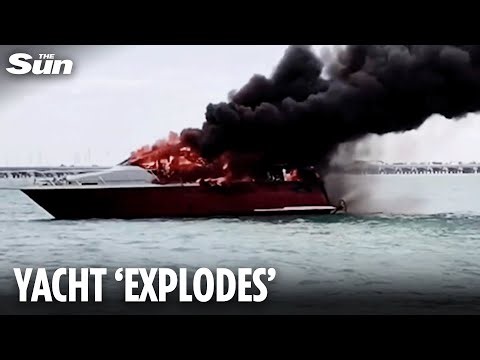 Luxury yacht EXPLODES in fireball forcing crew to leap into the sea in Mexico