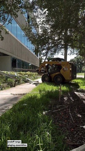 Cat 236D3 Skid Steer Using Extended Wrecking Pole to Rip Commercial Window Frames from Building