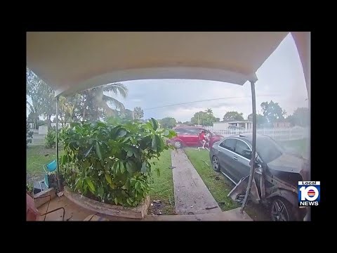 Video shows car crash into Miami-Dade house