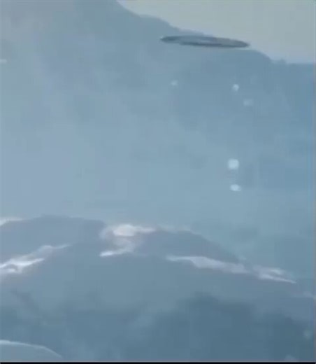 This is a UFO filmed by a Russian military helicopter near Sakhalin in 2023. This footage was leaked by a Russian soldier. The UFO is intimidating the helicopter because there is a UFO base on Sakhalin. This footage has finally come to be recognized as authentic.
