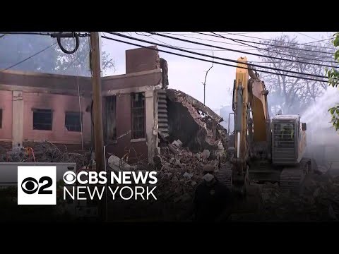 Firefighters continue putting out hot spots after massive warehouse fire in Belleville, N.J.