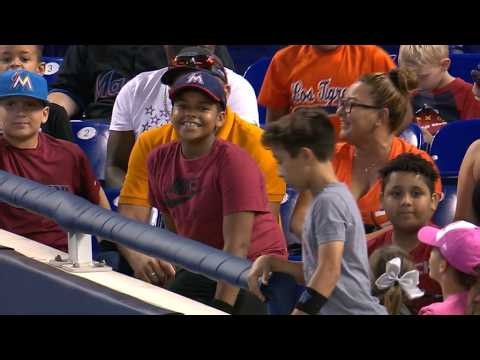 KC@MIA: Fan catches two foul balls in one at-bat