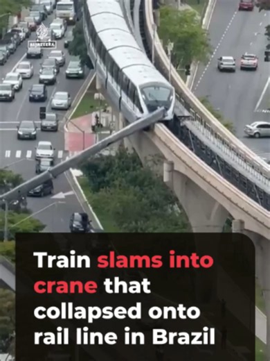 Video shows the moment a train collided with a crane that had fallen onto railway tracks in Brazil. After being struck by the train, the wreckage of the crane plunged into a street busy with traffic and pedestrians. The crane operator was injured in the incident in Sao Paulo.