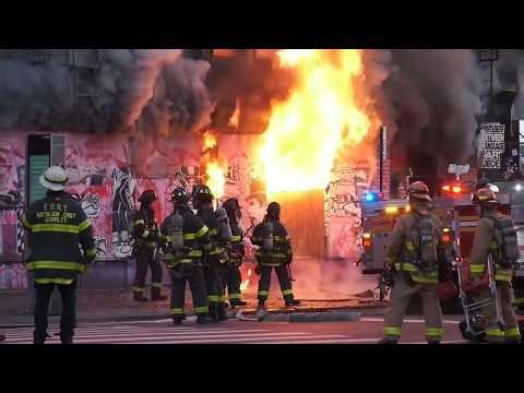 2 firefighters hurt after flames engulf vacant apartment building in Manhattan