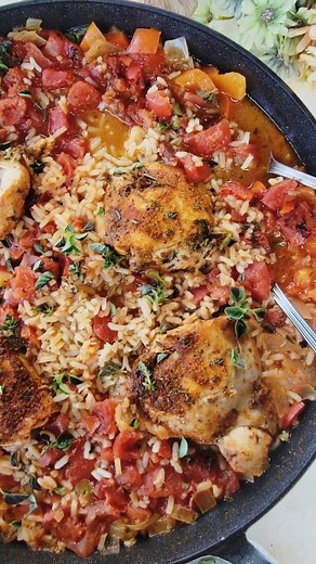 Easy One Pan Spanish Chicken and Rice…zesty, bold, and the chicken is incredibly tender. A simple homemade blend of spices comes together to give the chicken and rice zesty, bold flavors in roughly 30 minutes. The chicken cooks in a flavorful broth, which makes the chicken full of flavor and tender. This flavorful chicken is the perfect weeknight meal staple that requires very little work but is truly delicious! This meal freezes well and can be frozen for up to 2 months or stored in the refrige