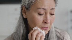 Portrait of sad middle aged woman crying and drying her tears with tissue Free Stock Video Footage