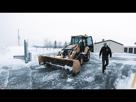Plowing Heavy, Wet Snow and Backhoe Wheelies