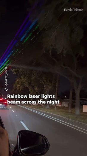 A vibrant rainbow laser installation lit up the night as part of Winter Pride St. Pete in Florida. | Sarasota Herald-Tribune