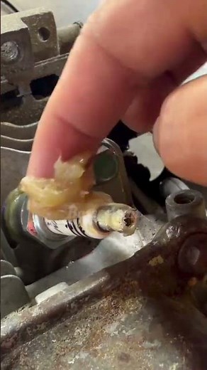 Putting grease in spark plugs #automobile #automotivetools #mechanic #weldwheels #tools #diy #fyp