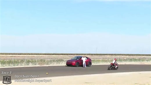 Tesla Drives Onto Live Race Track During Motorcycle Race, as Driver Nearly Kills People
