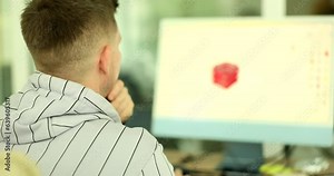 Male designer creates 3D model of product on computer. IT programmer working in office