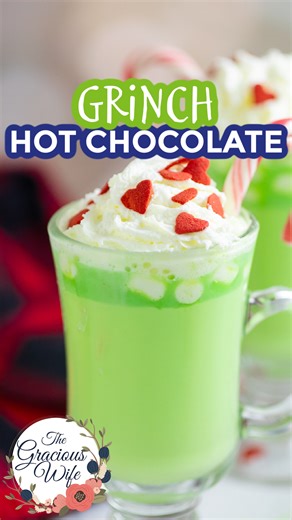 Make your holidays extra magical with this Grinch Hot Chocolate! Ultra creamy and sweet, this festive white hot chocolate drink is topped with whipped cream and a Grinchy red heart. Easy to make, even in large batches! 🎄❤️RECIPE❤️🎄 https://www.thegraciouswife.com/grinch-hot-chocolate/ | The Gracious Wife