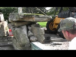 Setting Natural Stone Boulders to Create a Grotto Waterfall for this Swimming Pool Remodel
