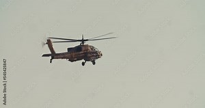 Apache Longbow military helicopter during combat flight