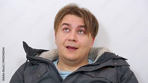 Portrait of man with dizziness, blinking gases, looking around naively, blow to head, injury, memory loss Patient recovers from anesthesia, weakness, psychological stress, drug intoxication Insurance