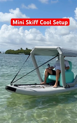 Mini Skiff setup with tent, chair, electric fin motor