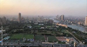 Cairo, Egyptpanoramic aerial sunset view of the Nile and downtown Cairo with traffic and boats seen from Cairo Tower - 29,Aug 2023.