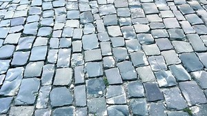 Download An old cobblestone pavement lined with gray stones of various shapes. for free