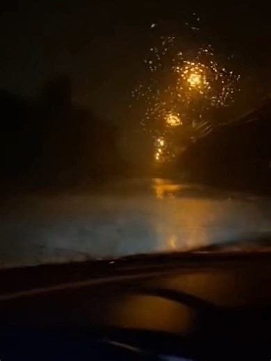 Lightning Reveals Eerie Figure on Stormy Road