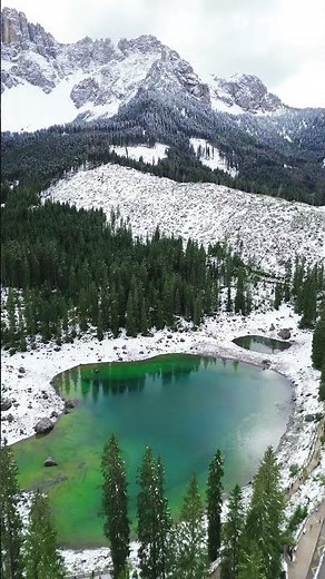 Scenic view of wonderul carezza lake in italian dolomits alps by drone #drone #dji #lake #mountains