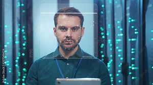 Future. Face Detection. Biometric Facial Recognition. ID Information Security. 3D Scanning of Face of Caucasian Server Engineer Working with Tablet at Data Center. Data Analyzing Animation with Points