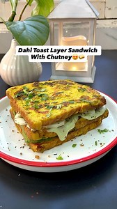 This 3-layer sandwich is packed with flavor and perfect for breakfast or meal. The tangy mint chutney is the real star, and once you make this, it will become your family favorite!Ingredients & calories-2 tbsp chickpea flour-2 tbsp low fat curd-2-3 whole wheat bread slices-Garlic Ginger Chilli to taste 1/4 tsp cumin seeds1/4 tsp Turmeric powder Salt to taste Pinch of black salt Coriander leaves Water Oil spray1 tbsp green chutney1/2 tbsp curd dip1/2 tomato4 tbsp cucumberOreganoChilli flakesTotal
