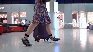 Girl's Feet Walking With Luggage In Airport Stock Footage SBV-334024023 - Storyblocks