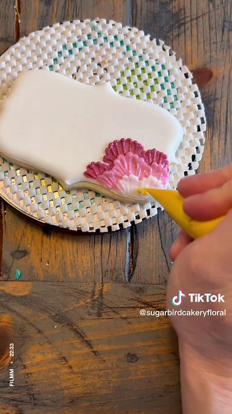 This royal icing brush embroidery technique create STUNNING floral designs on cookies. And it’s so easy! I use a fairly thick detail consistency icing and a small brush. You can use this to create a lacy effect as well. #royalicing #beginnerroyalicing #valentinescookies #easycookiedecorating #cookiedecorating #valentinesbaking #brushembroidery #royalicingtutorial #cookietutorial #cookiedecoratingtutorial