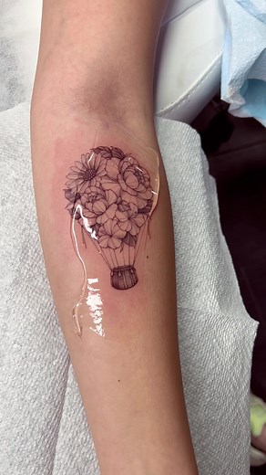 Floral hot air balloon! Love this one so much! More please:) #tattooartist #finelinetattoo #tattoo #tattoos #tattoolover #tattootiktok #nyctattoo #nyctattooartist #forearmtattoo #tattooidea #floraltattoo #hotairballoon