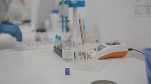 Red blood cell compatibility table. Donation. Donor and recipient. Lab technician does blood test to determine blood type, Rh factor, and compatibility. Blood drops with different types.