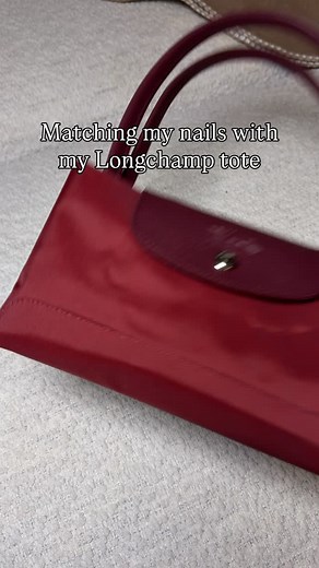 Matching my nails with my Longchamp tote ❤️ comment SHOP & I’ll dm you the links ❤️ I have used the Kiss Impress press on nails for years and tell everyone about them! I add some nail glue to make sure they stay and change them every 1-2 weeks. 💅 Pomegranate Longchamp green Le Pliage tote Kiss impress red press on nails Brush on nail glue Bag charms Comment SHOP below to receive a DM with the link to this post on my LTK ⬇ https://liketk.it/5A7fT #pressonnails #longchamp #longchamplepliage | Jes