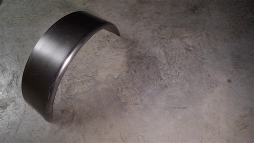 Showcasing one of our precision-crafted smooth rolled trailer fenders. Built for durability, symmetry, and that flawless curve every custom build deserves. Perfect finish, seamless edges, ready for paint or polish. Shop now! | The Trailer Parts Outlet