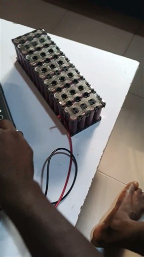 BUILDING OF 48V 10AH LITHIUM BATTERY FOR AN ELECTRIC BICYCLE USING 52 UNITS OF 18650 BATTERY CELLS.