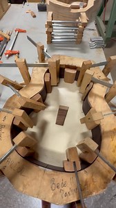 This is a guitar mold in action—clamps hold the sides, head block, and tail block securely in place while they dry, locking in the shape of the body to come. | Breedlove Guitars
