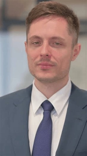 clip-3993145329-vertical-video-portrait-young-businessman-pointing-camera