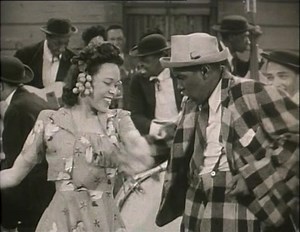 "Rhythm of the Rhythm Band" (1943) is a soundie performed by The Musical Madcaps. The band also performed in "Stormy Weather" (1943) as The Tramp Band with Bill Robinson. The lady dancer in the video is Nikki O'Daniels. O'Daniel's appeared in several soundies and Race Films in the 1940s. There is little information about the gentleman dancing with O'Daniels. This number is a smooth jam session by some trailblazing musicians. https://www.daarac.ngo https://www.daaracarchive.org | Black Film Histo
