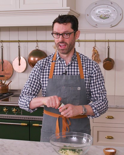 This Amazing Spring Green Soup is Bursting with flavor with a creamy silky smooth texture that contrasts wonderfully with crisp flaverful parmesan crisps. Grab a copy of my book for the recipe! | Preppy Kitchen