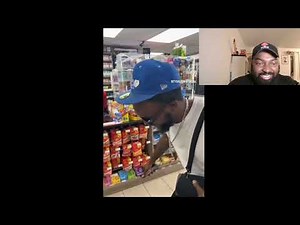 Black man dancing to Indian music in a corner shop