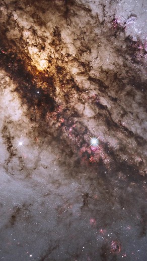 Eleven million light-years away, the galaxy Centaurus A shines. Hubble's extraordinary vision, which stretches from ultraviolet through near-infrared wavelengths, reveals the vibrant glow of young, blue star clusters and a glimpse into regions normally obscured by dust. Image credit: NASA, ESA, and the Hubble Heritage (STScI/AURA)-ESA/Hubble Collaboration; Acknowledgment: R. O'Connell (University of Virginia) and the WFC3 Scientific Oversight Committee Music credit: Stock Music provided by CoolT