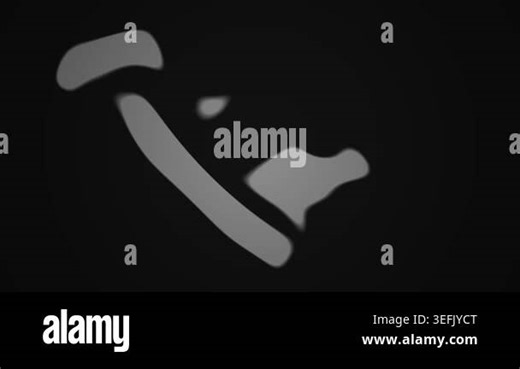 Grey telephone handset on black background Stock Video Footage - Alamy