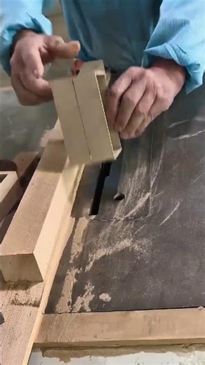 assembling a small rectangular wooden box precisely using a table saw and wood glue in a workshop