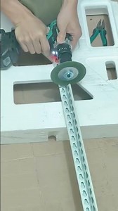 cutting slotted steel angle bar manually using electric drill
