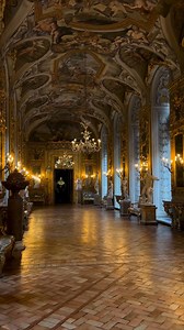 The stunning Hall of Mirrors at the Galleria Doria Pamphilj in Rome 😲✨ A masterpiece of 18th-century elegance, this breathtaking gallery — designed by Gabriele Valvassori — glows with gold-framed Venetian mirrors and antique statues, creating a mesmerizing interplay of light and history. Look up, and you’ll find Aureliano Milani’s vaulted frescoes, depicting the Labors of Hercules, a nod to the Pamphilj family's legendary lineage tracing back to the Greek hero himself. Rome is filled to the bri